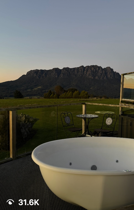 Short-form video sample featuring an outdoor soaking tub and mountain backdrop