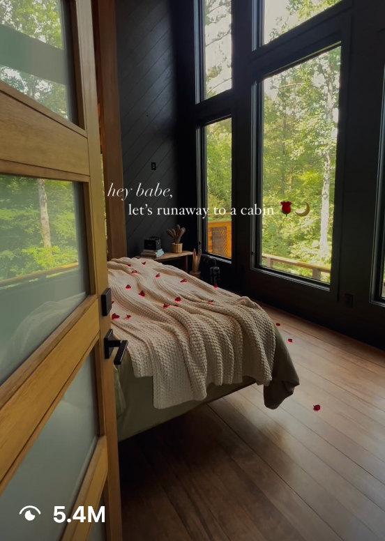 Short-form video sample showing a cozy cabin bedroom with large windows