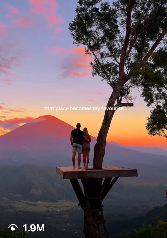 Short-form video sample showing a couple looking out at a dramatic sunset and mountain view